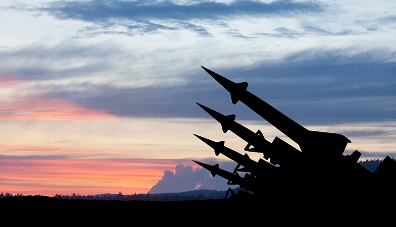 Image of nuclear weapons with sunset in background