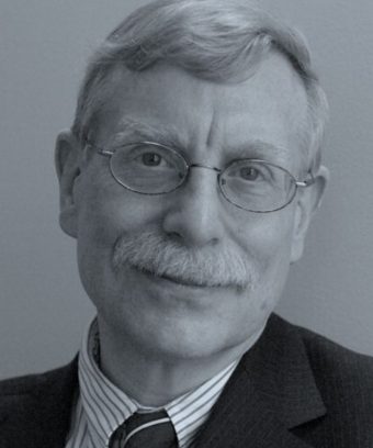 headshot photo of William Bonvillian, an older white man with glasses, gray hair and a gray mustache